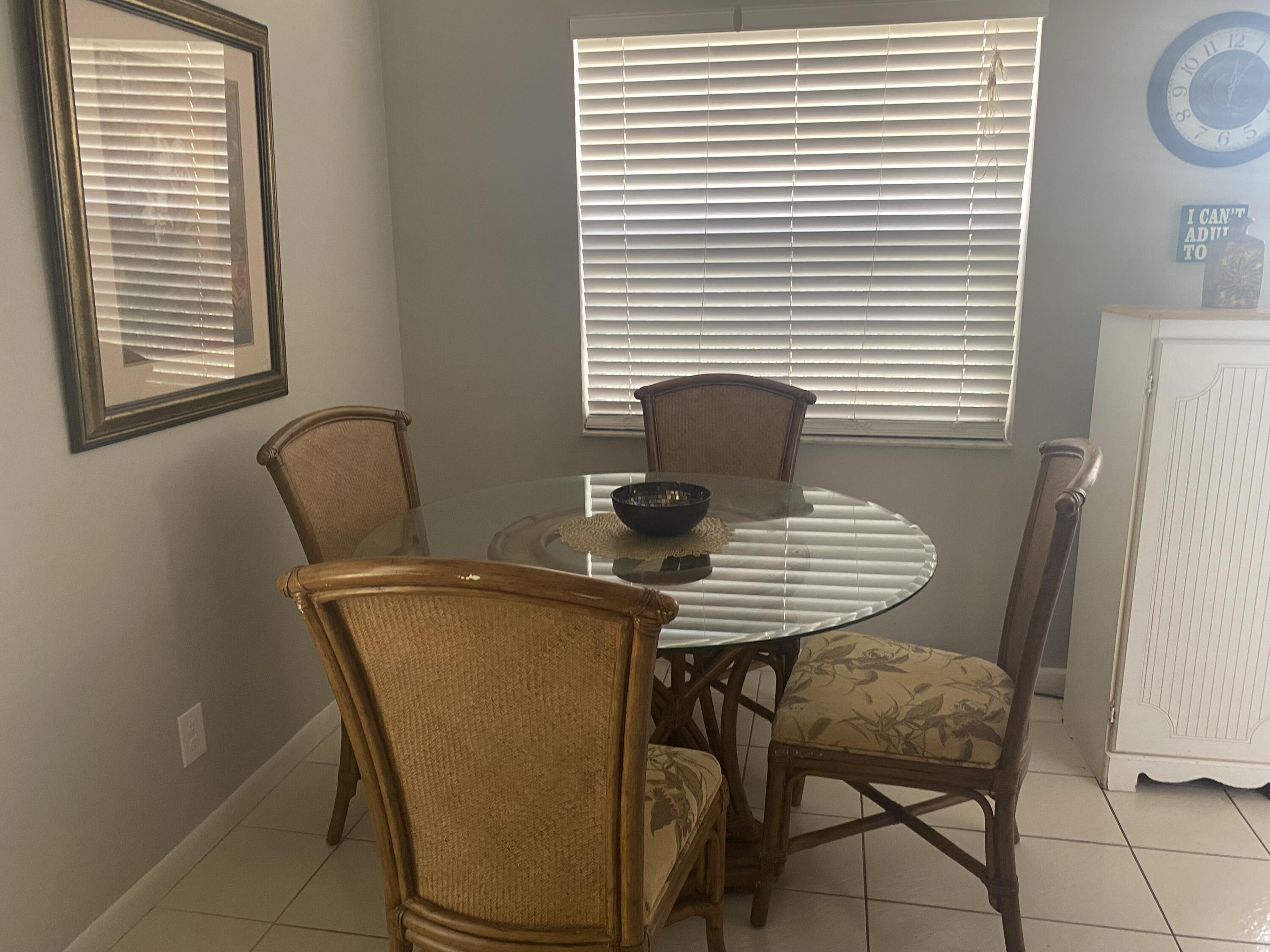 542 Normandy Lane, Unit 542 NORMANDY L Delray Beach, FL 33484 - Photo 8 of 41 a view of a room with a table and chairs