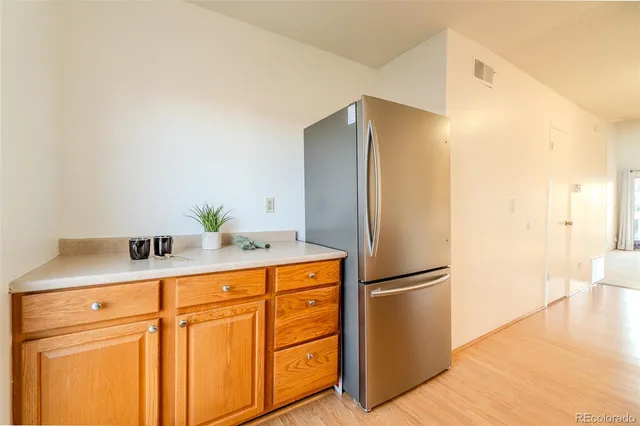 a kitchen with stainless steel appliances a refrigerator and a sink