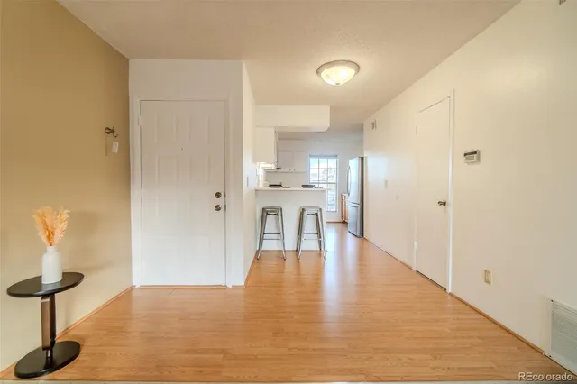 a view of a kitchen with wooden floor