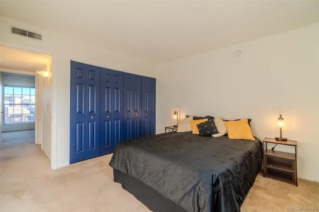 a bedroom with a bed and closet