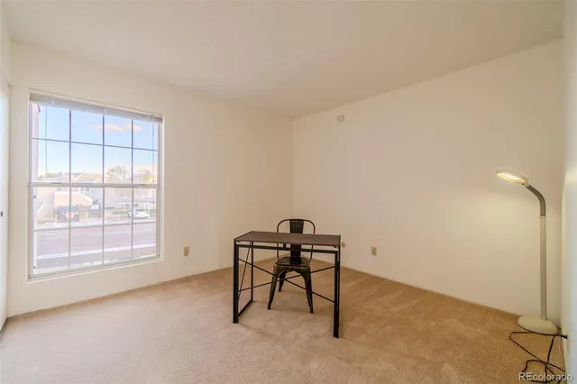 a workspace with furniture and window