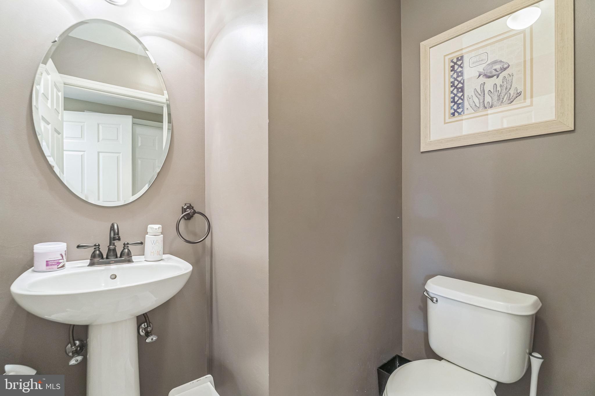 112 Lantern Way Deptford, NJ 08096 - Photo 13 of 30 a bathroom with a toilet a sink and a mirror