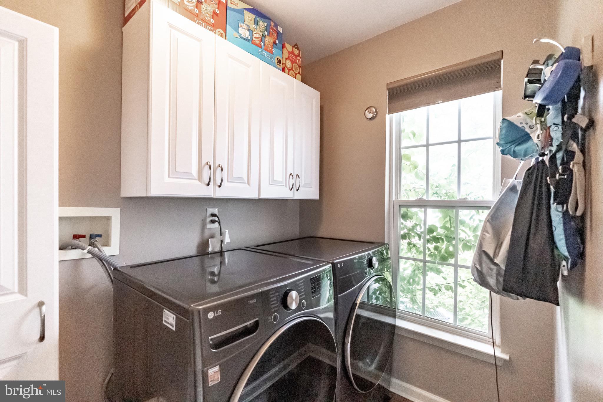 112 Lantern Way Deptford, NJ 08096 - Photo 14 of 30 a utility room with cabinets washer and dryer