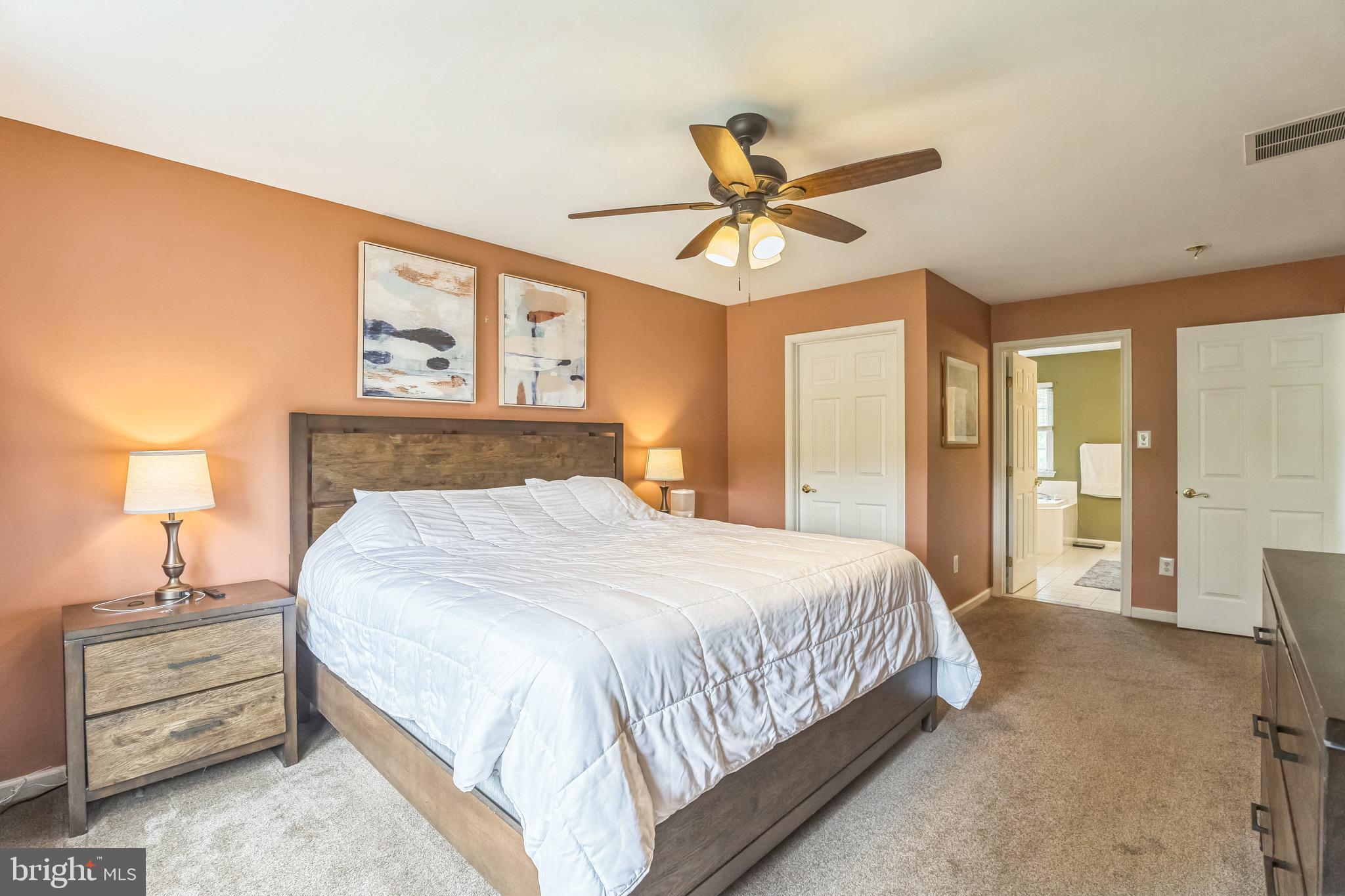 112 Lantern Way Deptford, NJ 08096 - Photo 15 of 30 a bedroom with a bed and wooden floor