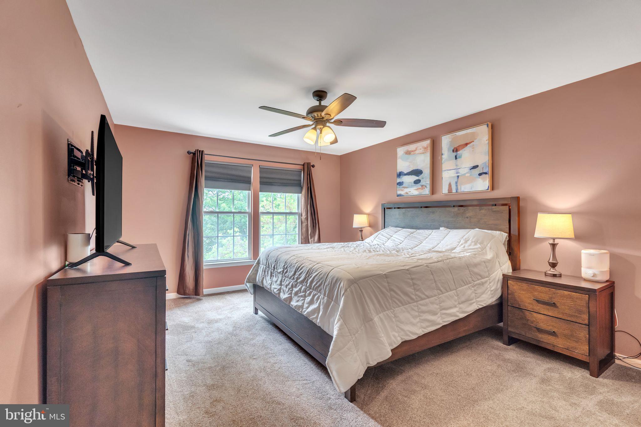 112 Lantern Way Deptford, NJ 08096 - Photo 16 of 30 a bedroom with a bed and a chandelier