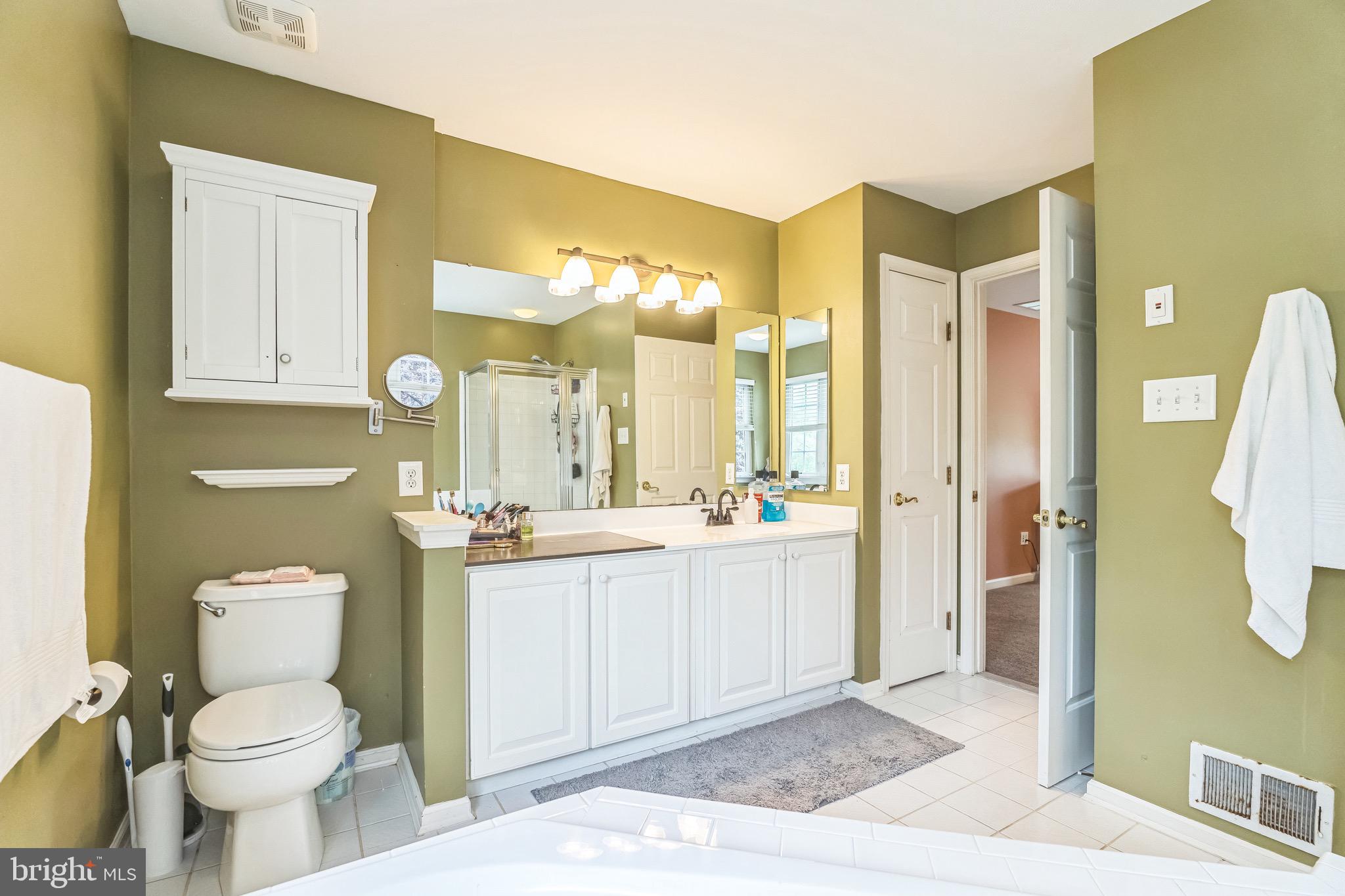 112 Lantern Way Deptford, NJ 08096 - Photo 17 of 30 a bathroom with a toilet sink and a mirror