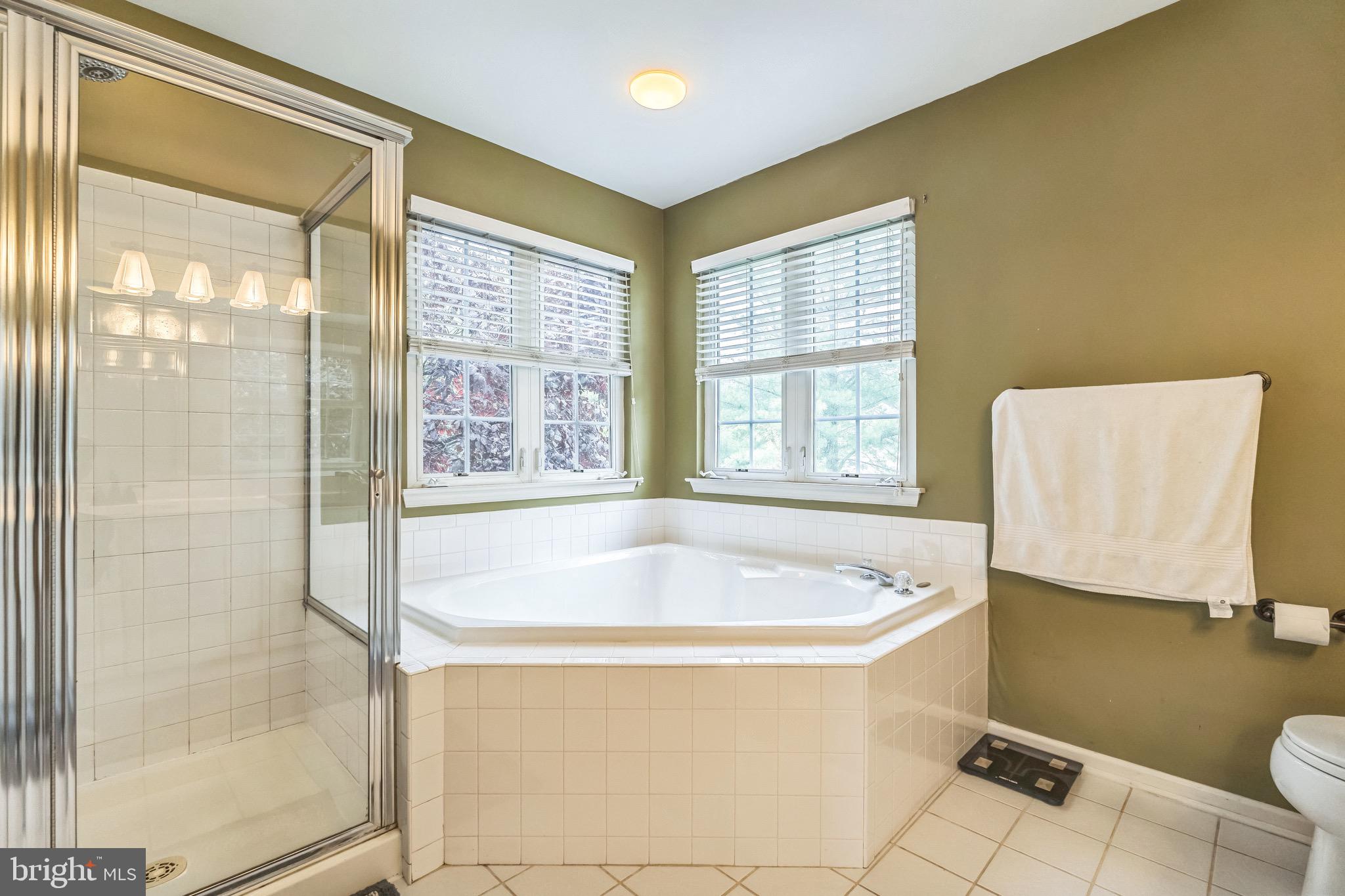 112 Lantern Way Deptford, NJ 08096 - Photo 18 of 30 a bath tub sitting in a bathroom next to a window