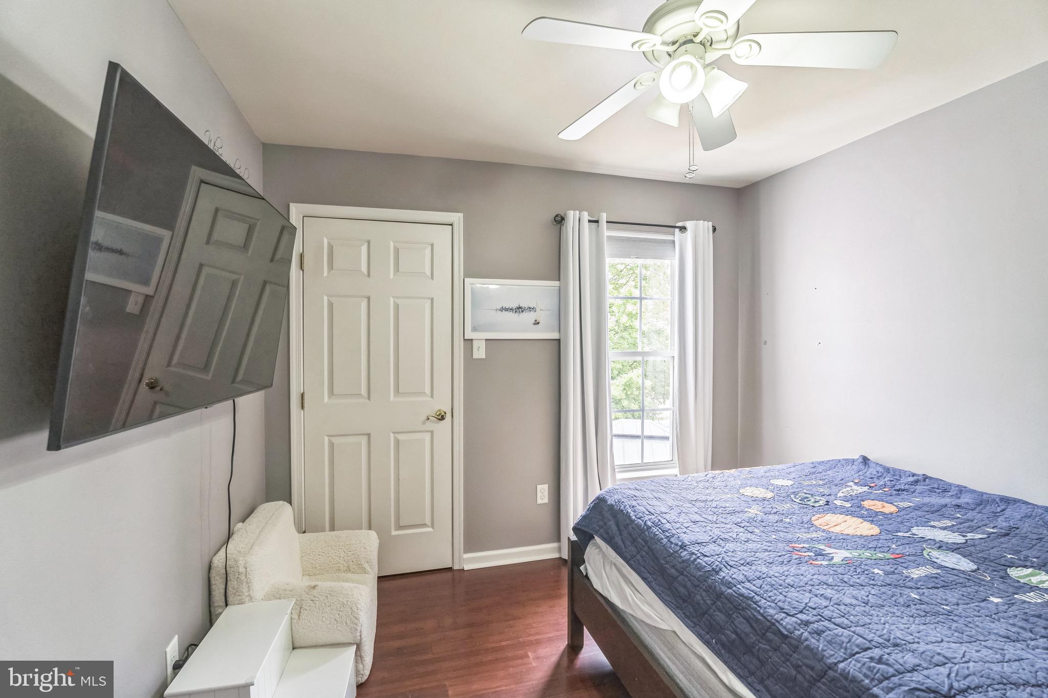 112 Lantern Way Deptford, NJ 08096 - Photo 20 of 30 a bedroom with a bed and a chandelier