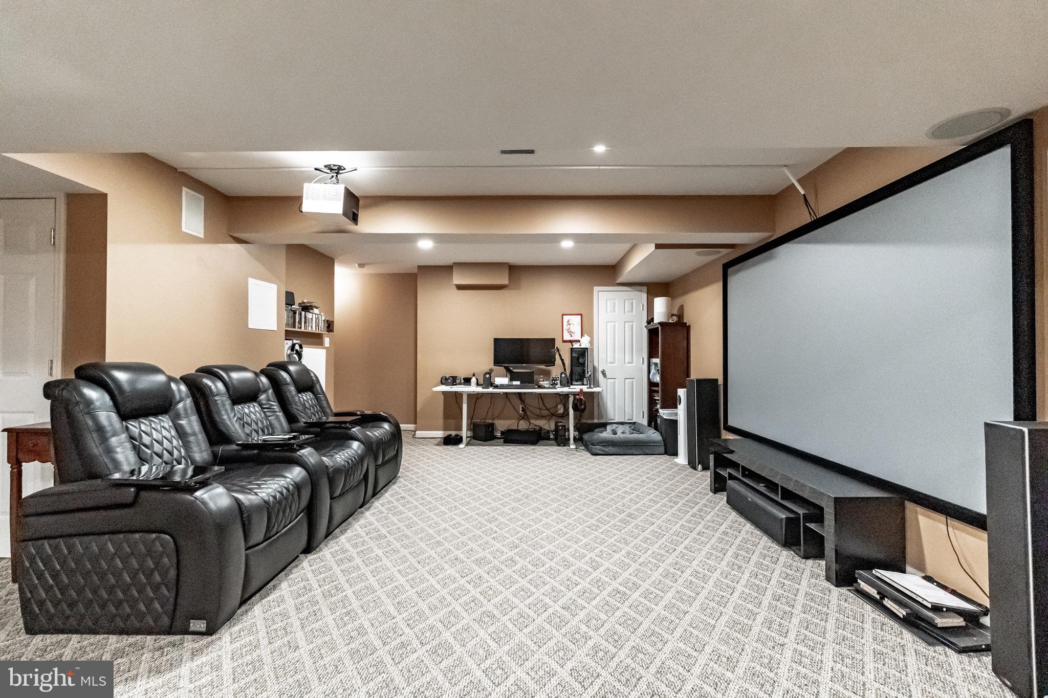 112 Lantern Way Deptford, NJ 08096 - Photo 23 of 30 a living room with furniture gym machine and a flat screen tv