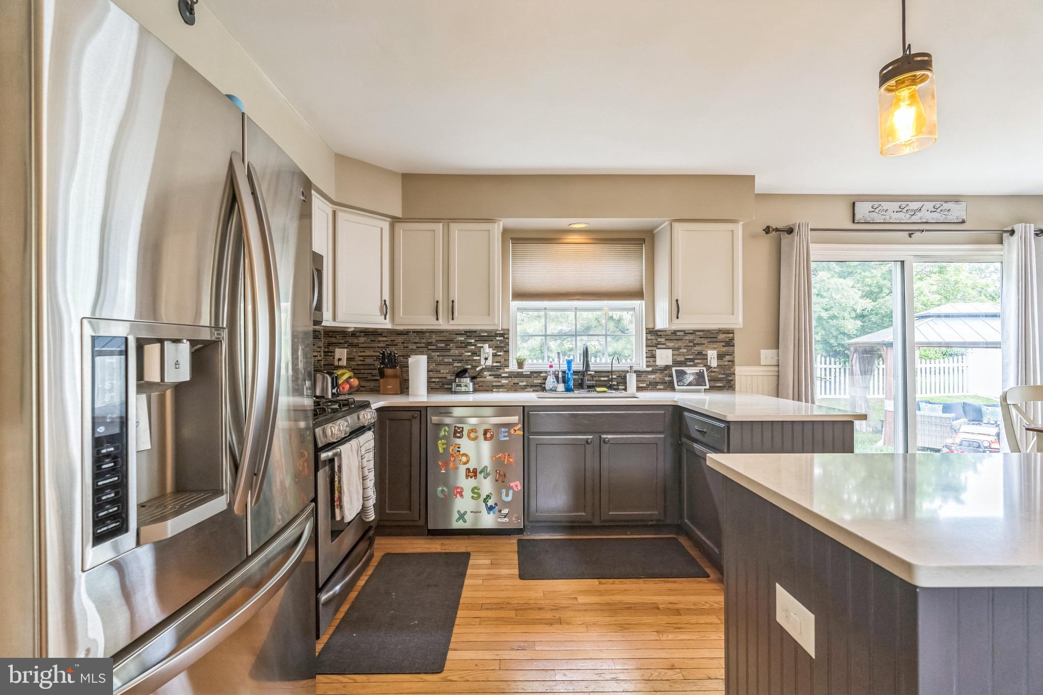 112 Lantern Way Deptford, NJ 08096 - Photo 8 of 30 a kitchen with stainless steel appliances granite countertop a refrigerator a sink a stove and island
