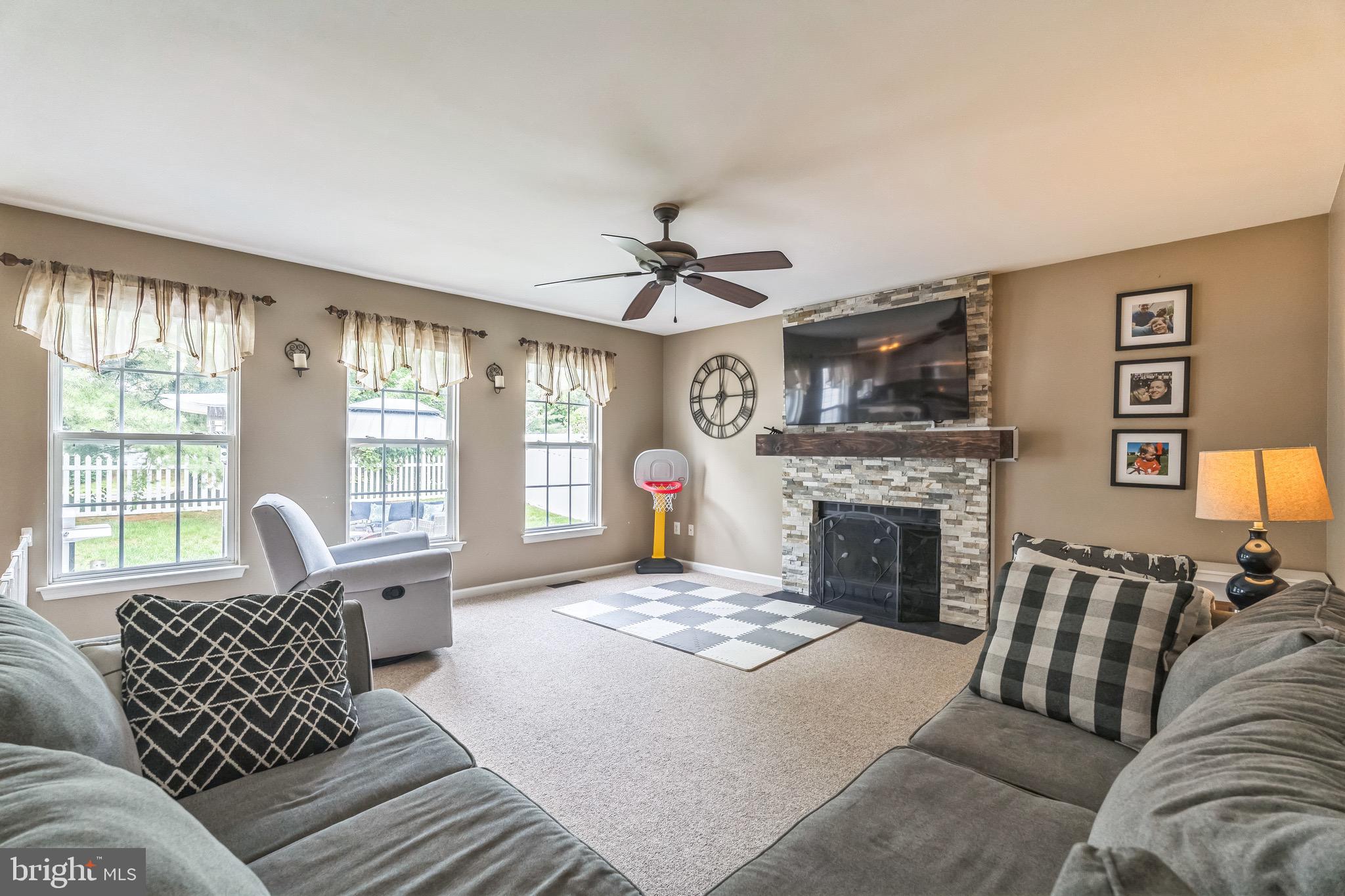 112 Lantern Way Deptford, NJ 08096 - Photo 10 of 30 a living room with furniture fireplace and a large window