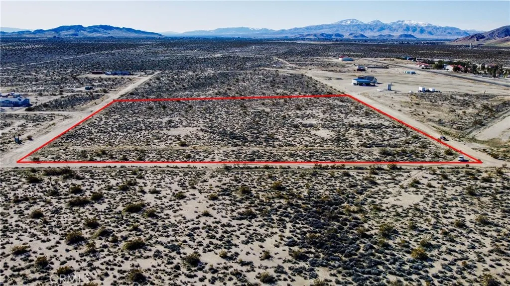 0 Fickett Mojave, CA 93501 - Photo 2 of 18 a view of a pathway with a garden