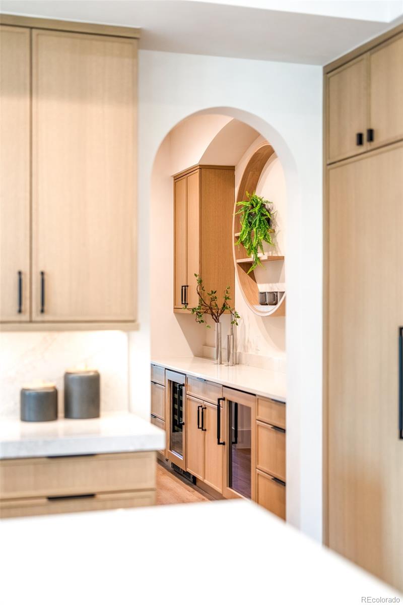 404 Kearney Street Denver, CO 80220 - Photo 12 of 44 a picture of a kitchen with a sink and a mirror