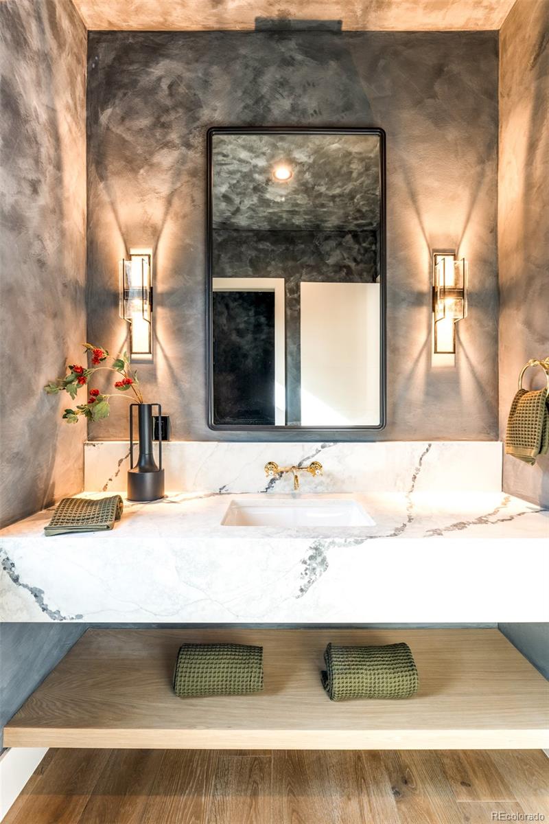 404 Kearney Street Denver, CO 80220 - Photo 14 of 44 a bathroom with a sink and a mirror