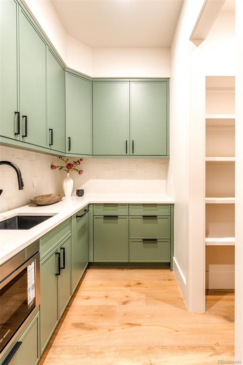 404 Kearney Street Denver, CO 80220 - Photo 16 of 44 a bathroom with a sink and a mirror