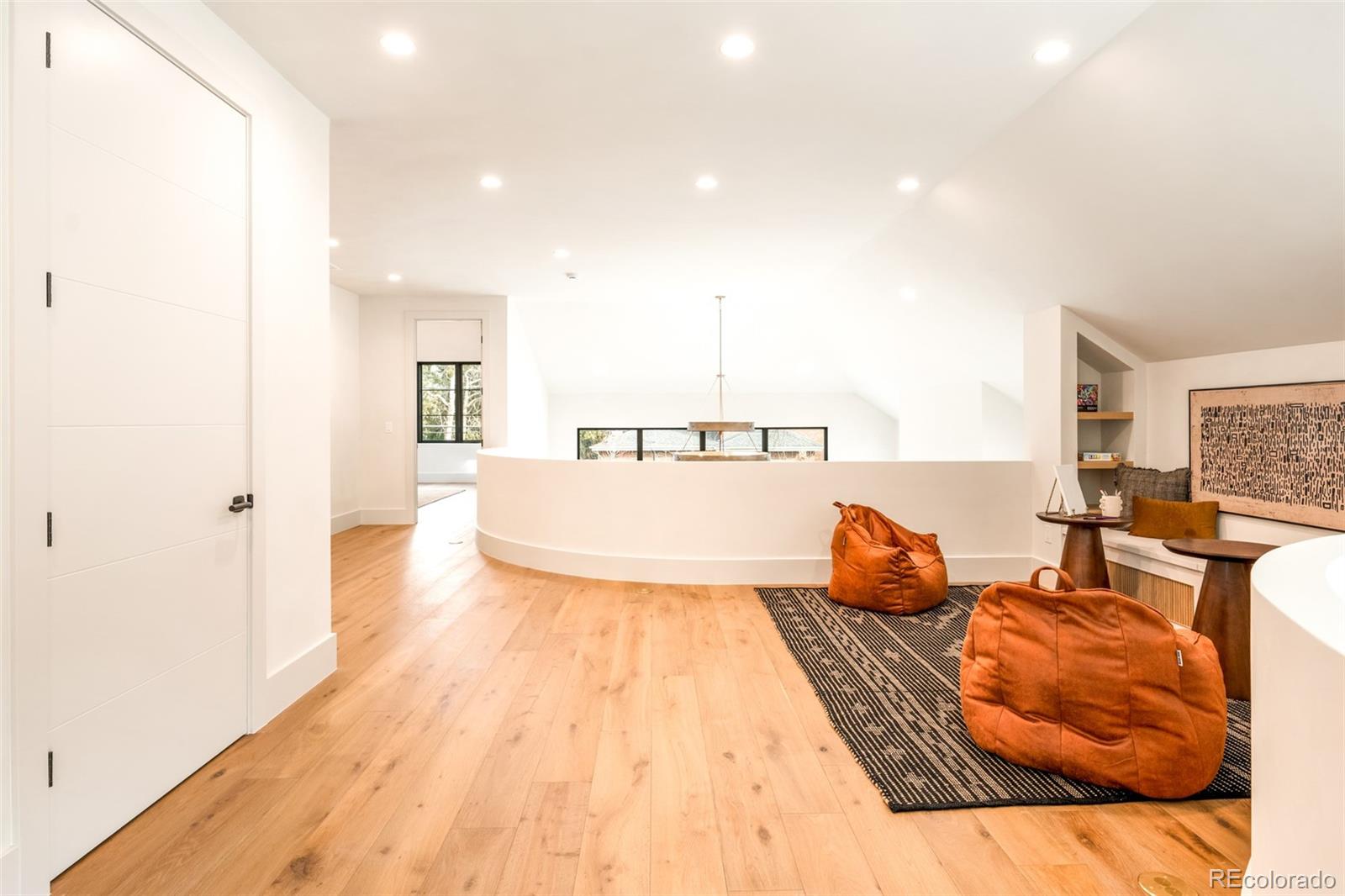 404 Kearney Street Denver, CO 80220 - Photo 19 of 44 a spacious bedroom with a bed and a couch