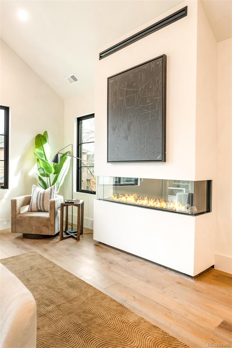404 Kearney Street Denver, CO 80220 - Photo 21 of 44 a living room with furniture and a flat screen tv