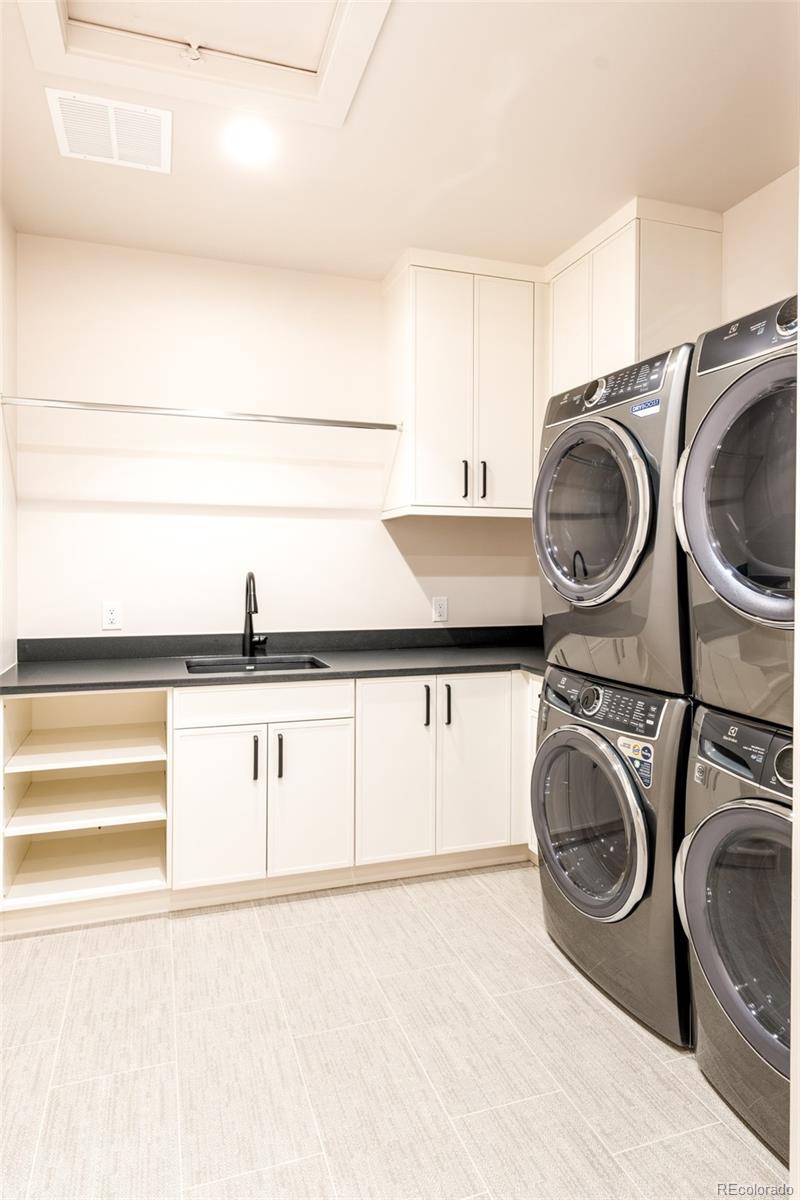 404 Kearney Street Denver, CO 80220 - Photo 29 of 44 a utility room with sink dryer and washer