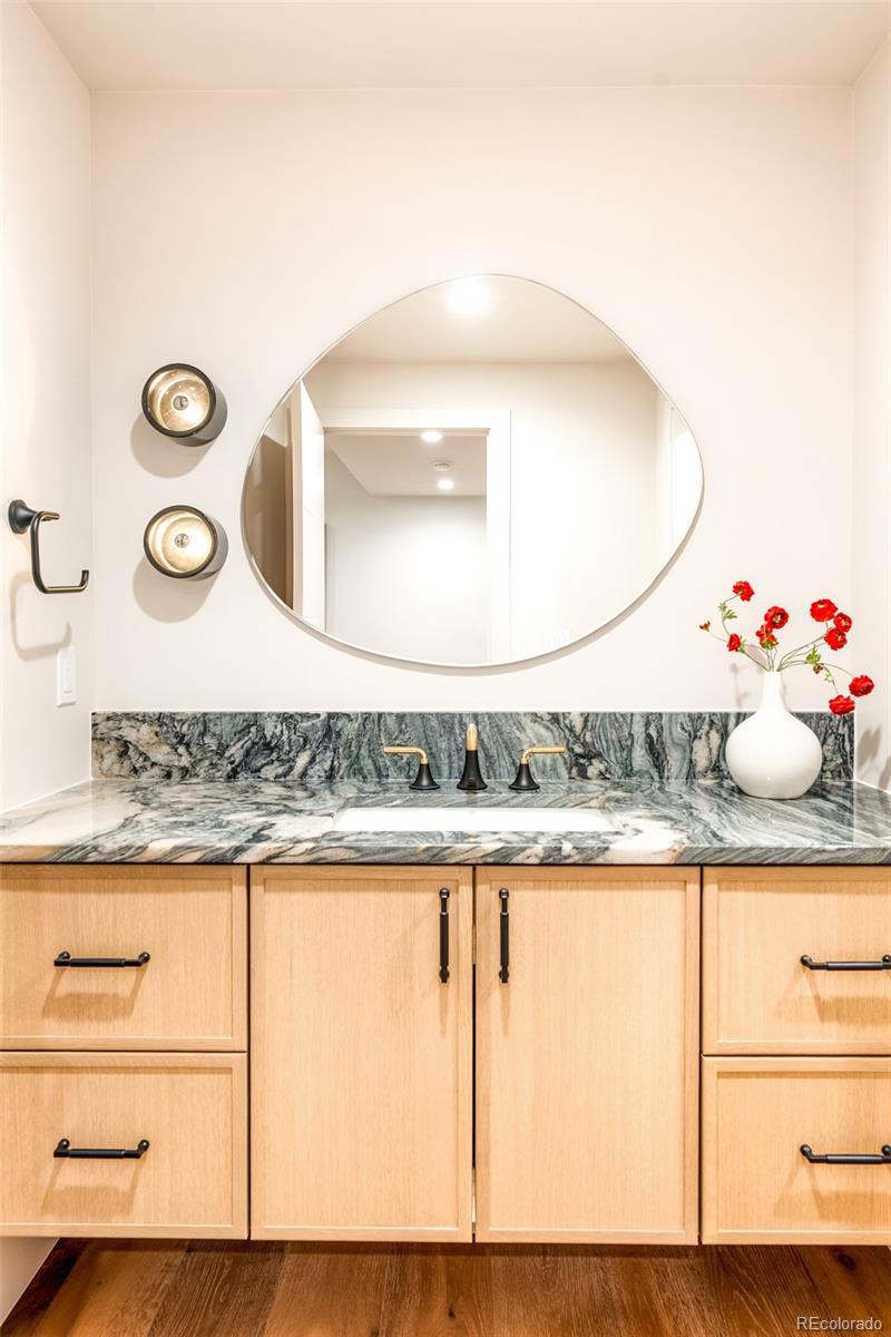 404 Kearney Street Denver, CO 80220 - Photo 34 of 44 a bathroom with a sink and mirror