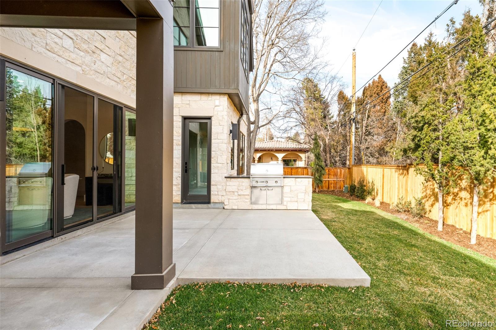 404 Kearney Street Denver, CO 80220 - Photo 36 of 44 a front view of a house with a yard and trees