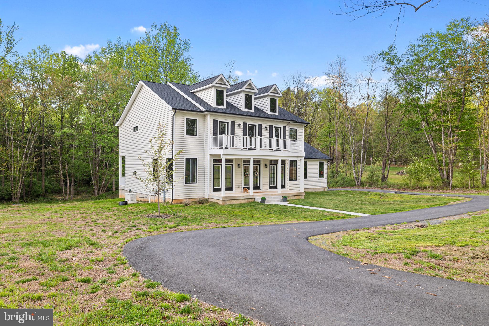 86 Hinsons Ford Road Amissville, VA 20106 - Photo 2 of 64 a view of a house with a big yard and palm trees