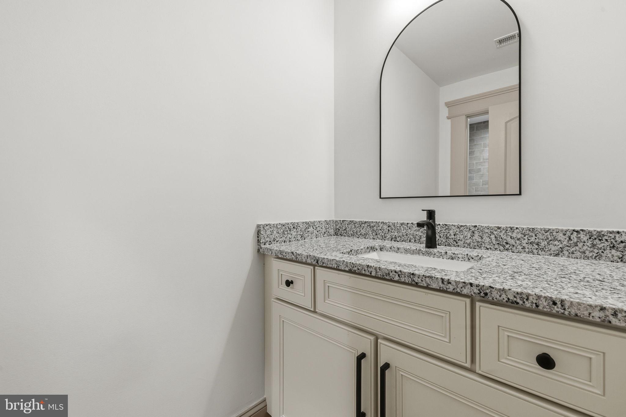 86 Hinsons Ford Road Amissville, VA 20106 - Photo 40 of 64 a bathroom with a granite countertop sink and mirror