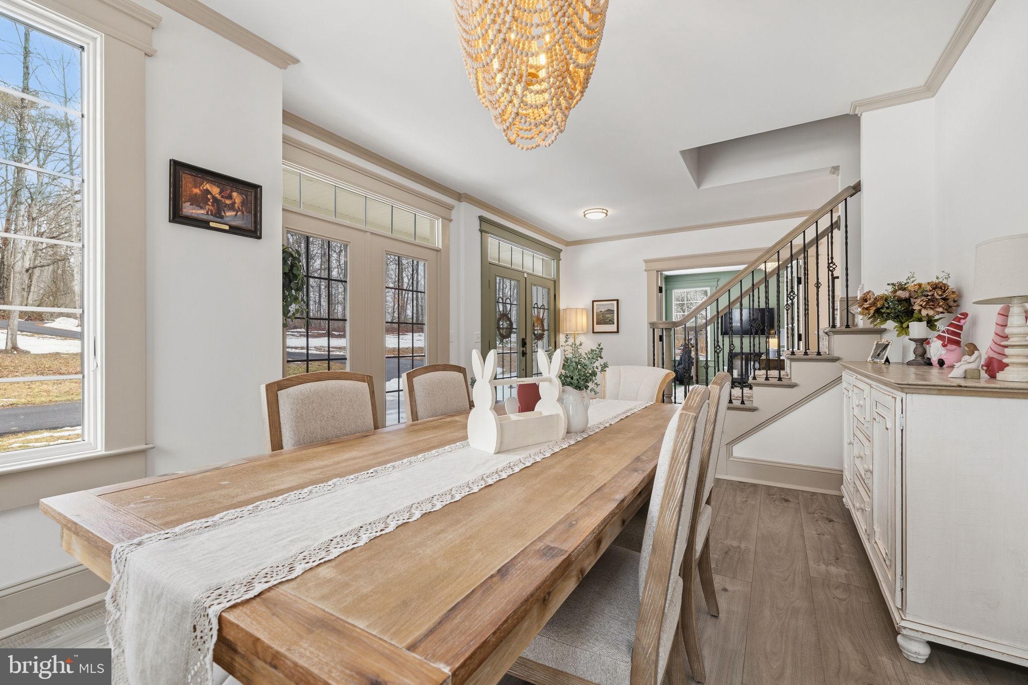 86 Hinsons Ford Road Amissville, VA 20106 - Photo 10 of 64 a dining room with wooden floor and a chandelier