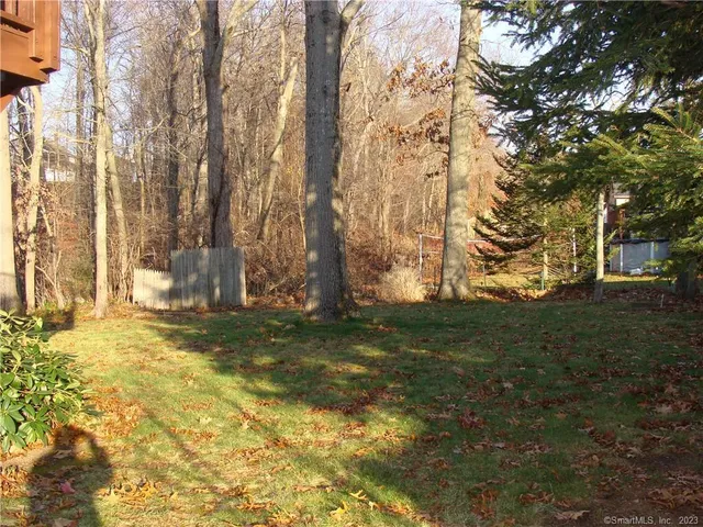 a kitchen with a refrigerator and a sink