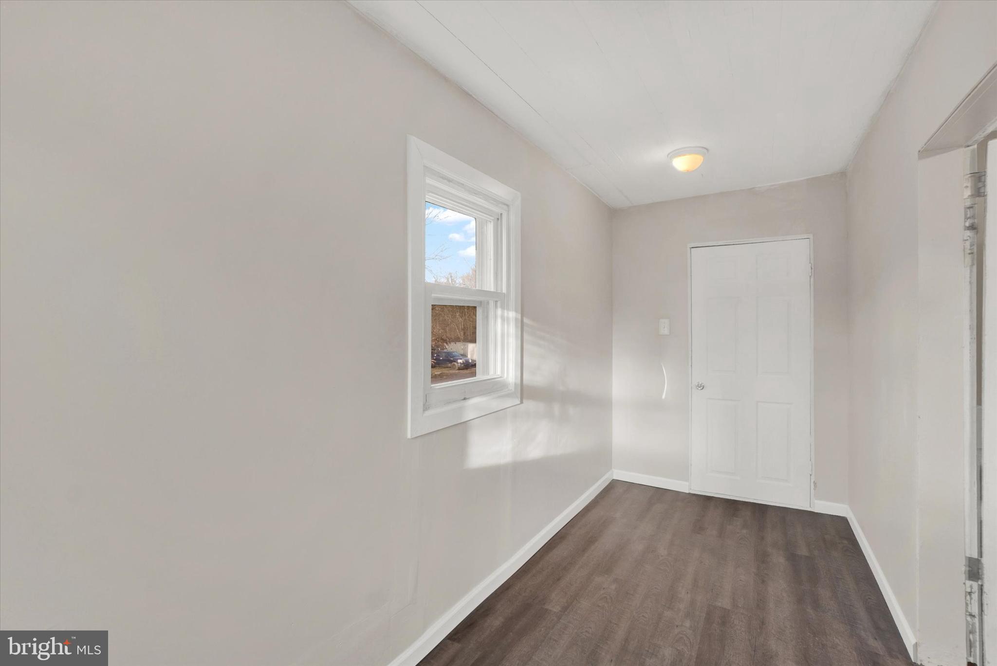 1953 Craley Road Windsor, PA 17366 - Photo 11 of 28 a view of wooden floor and windows in a room
