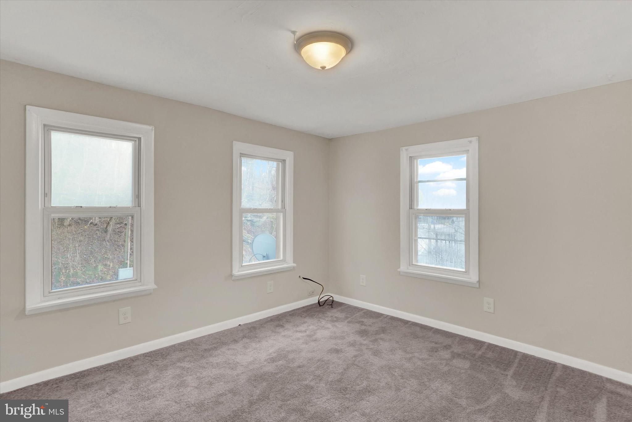 1953 Craley Road Windsor, PA 17366 - Photo 13 of 28 an empty room with windows and mirror