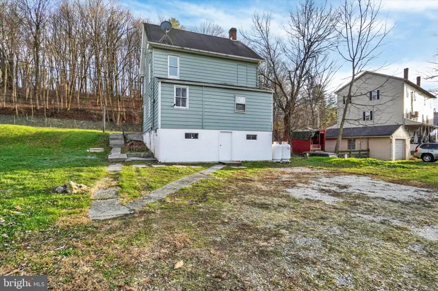 a view of a park with large trees