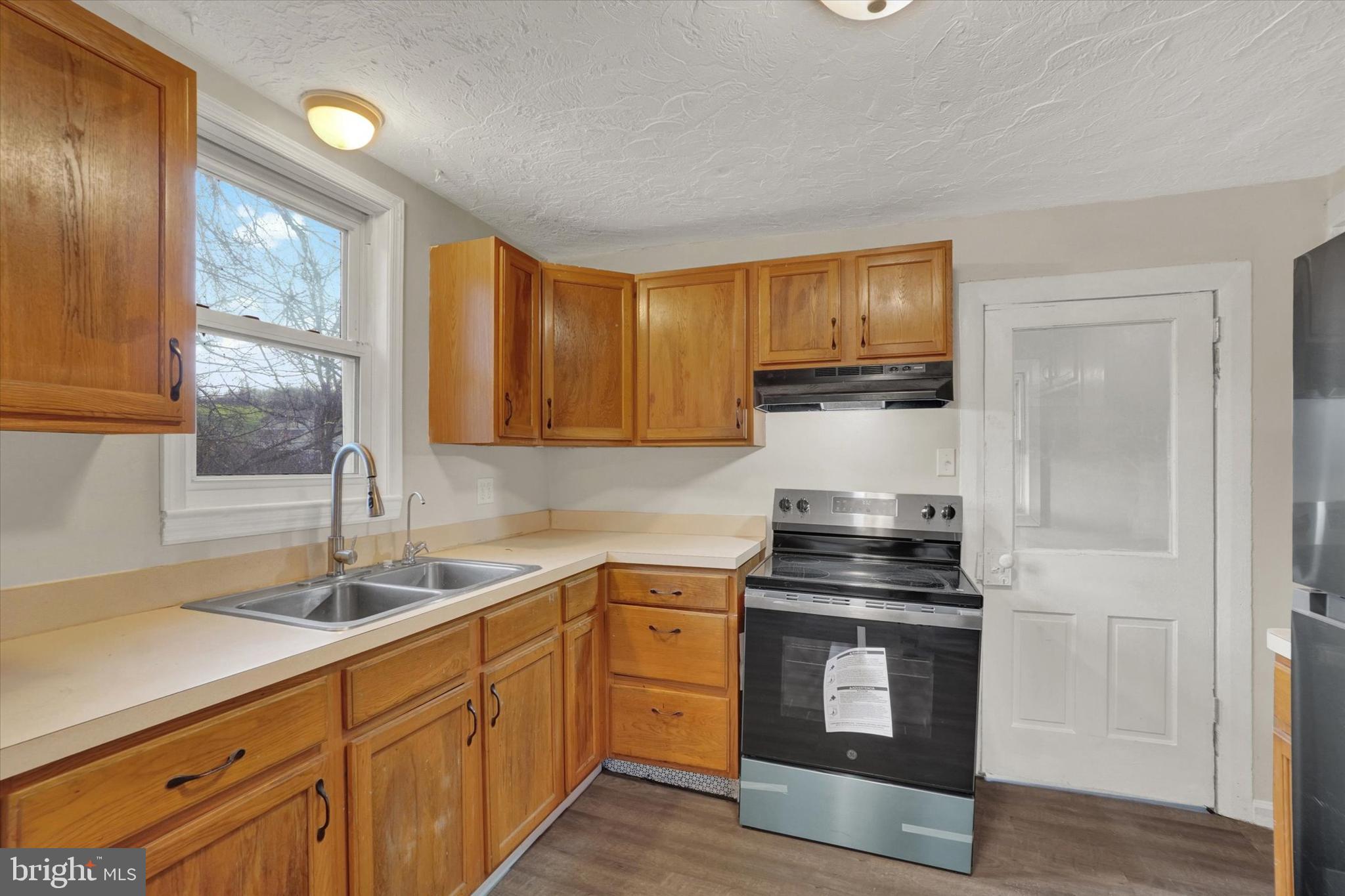 1953 Craley Road Windsor, PA 17366 - Photo 7 of 28 a kitchen with sink a microwave and cabinets