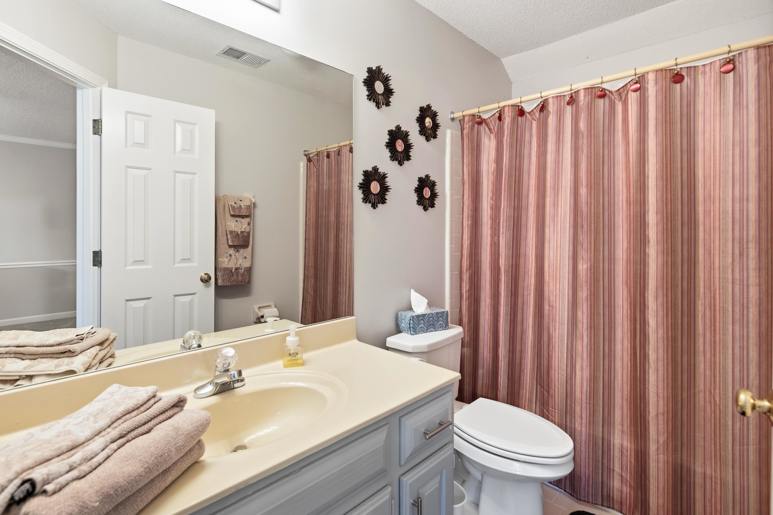 10281 Peyton Path Cove Collierville, TN 38017 - Photo 13 of 40 Bathroom featuring vanity, a shower with shower curtain, and a textured ceiling