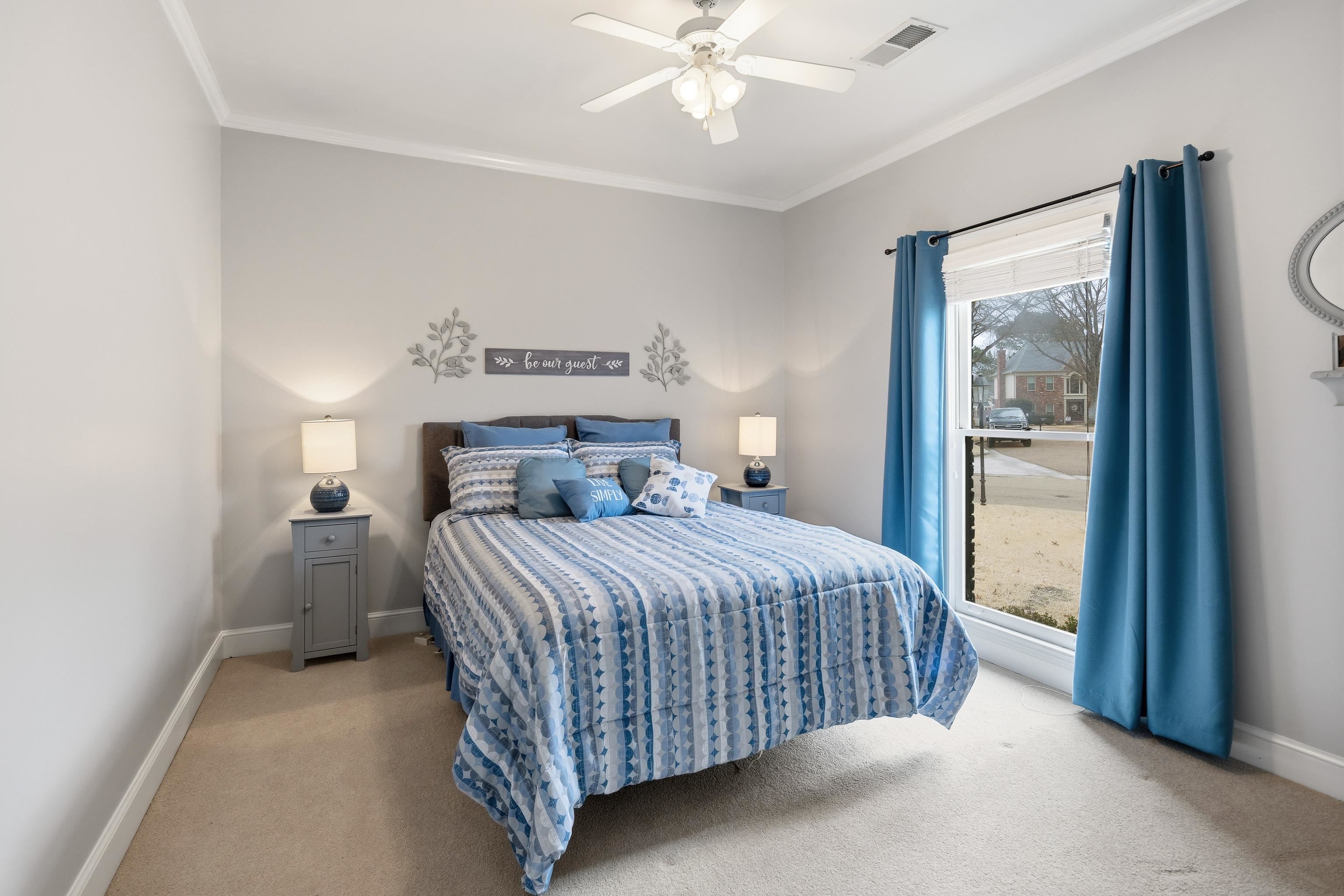 10281 Peyton Path Cove Collierville, TN 38017 - Photo 25 of 40 a bedroom with a bed and a chandelier