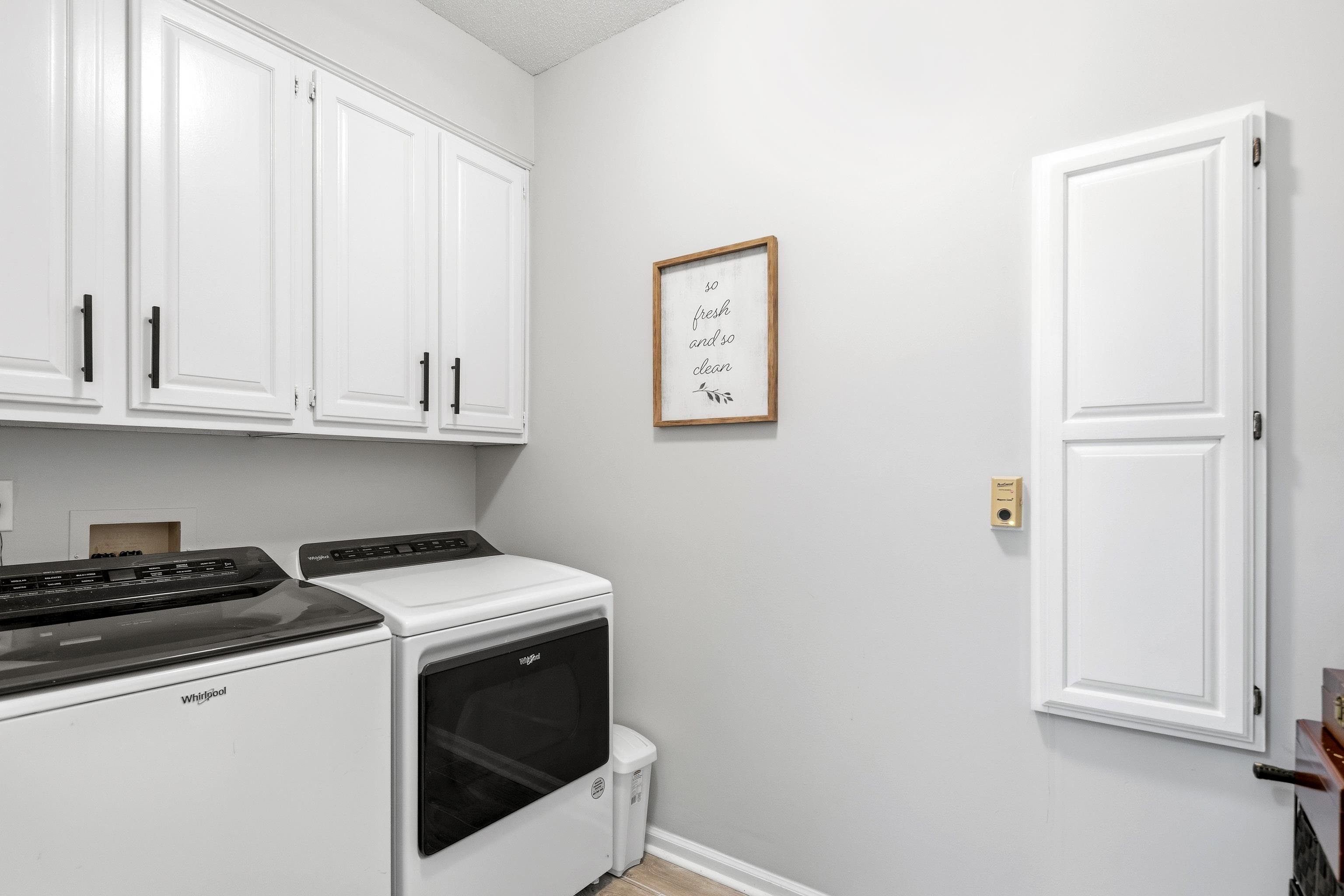 10281 Peyton Path Cove Collierville, TN 38017 - Photo 37 of 40 Laundry area featuring cabinet space and independent washer and dryer