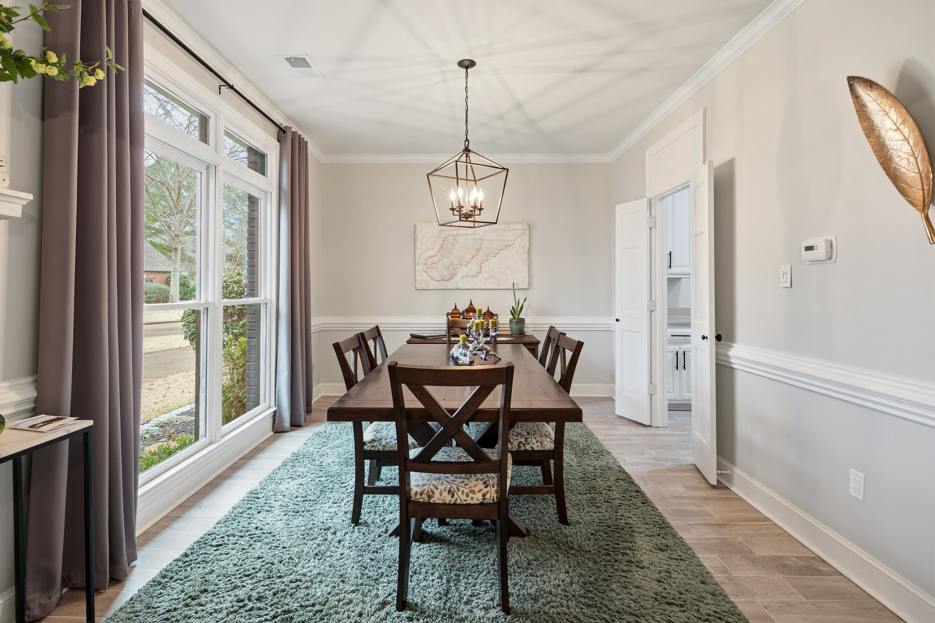 10281 Peyton Path Cove Collierville, TN 38017 - Photo 6 of 40 a view of a dining room with furniture window and wooden floor