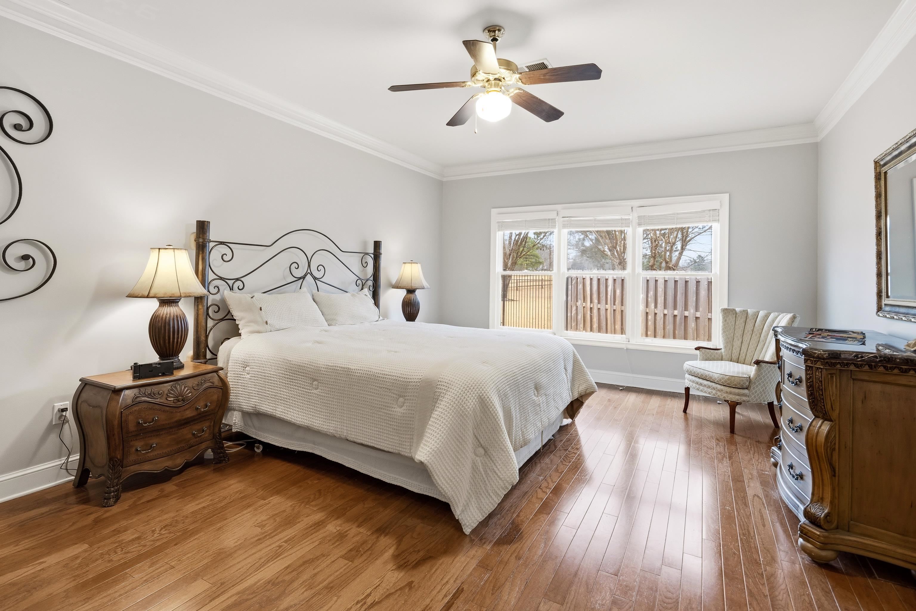 10281 Peyton Path Cove Collierville, TN 38017 - Photo 8 of 40 Bedroom featuring crown molding, hardwood / wood-style flooring, and ceiling fan