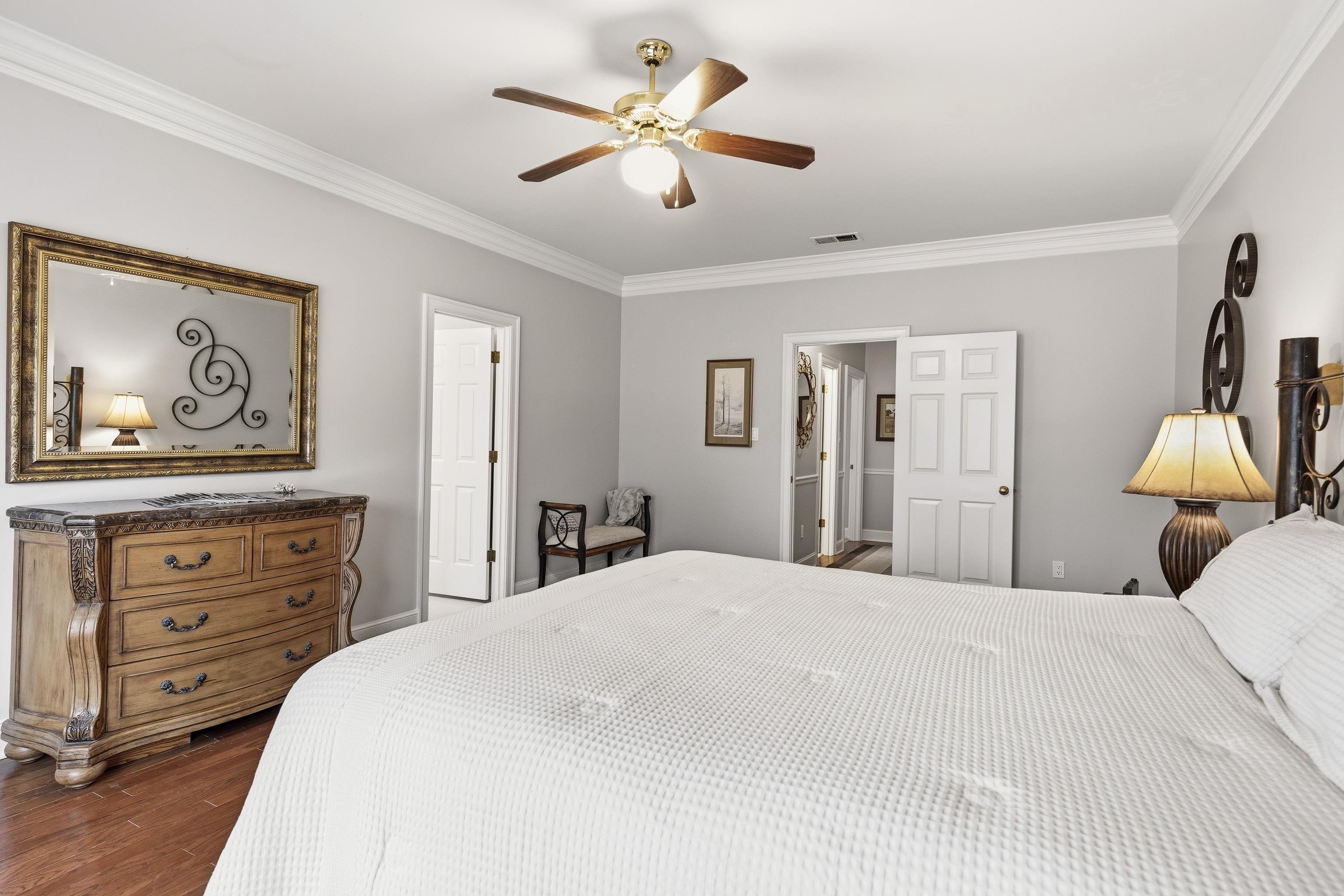 10281 Peyton Path Cove Collierville, TN 38017 - Photo 9 of 40 Bedroom with ornamental molding, dark wood-type flooring, and a ceiling fan