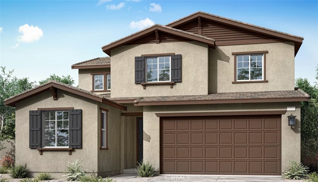 a front view of a house with a garage
