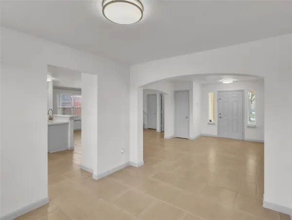 a view of a big room with windows and cabinet