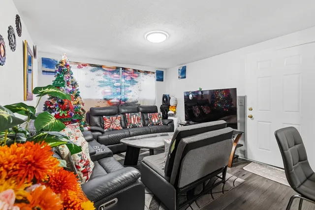 a outdoor living room with furniture and flowers