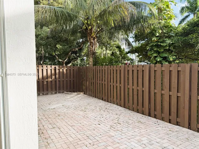 a view of a house with a small yard