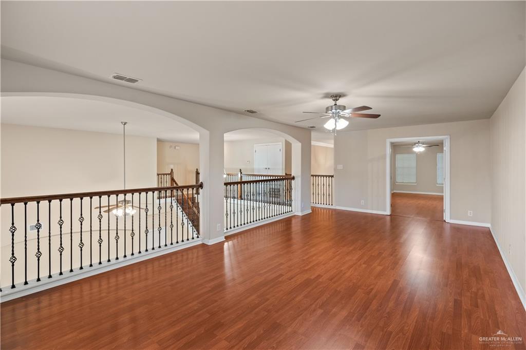 2806 San Ricardo Street Mission, TX 78572 - Photo 13 of 29 a view of a room wooden floor staircase and a kitchen