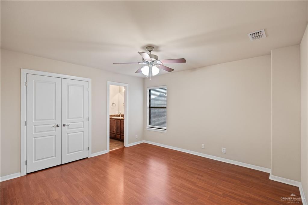 2806 San Ricardo Street Mission, TX 78572 - Photo 17 of 29 a view of an empty room with wooden floor