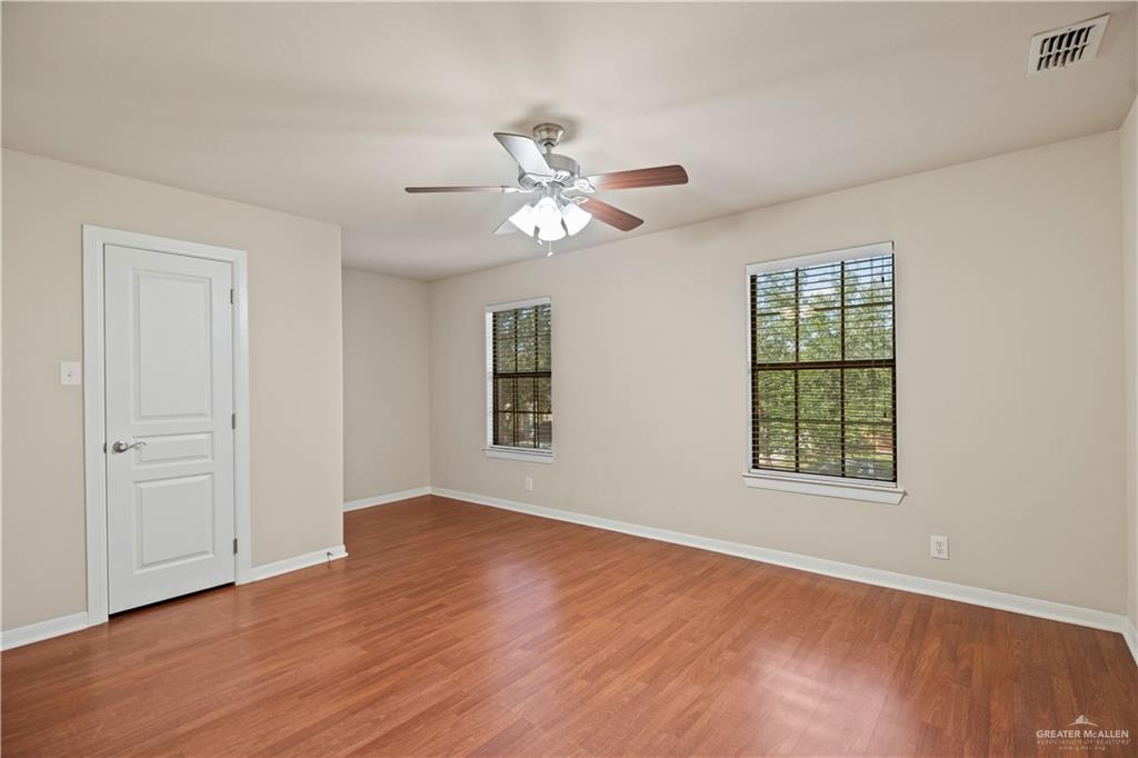 2806 San Ricardo Street Mission, TX 78572 - Photo 19 of 29 wooden floor in an empty room with a window