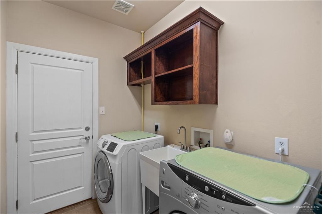 2806 San Ricardo Street Mission, TX 78572 - Photo 25 of 29 a room with storage and utility