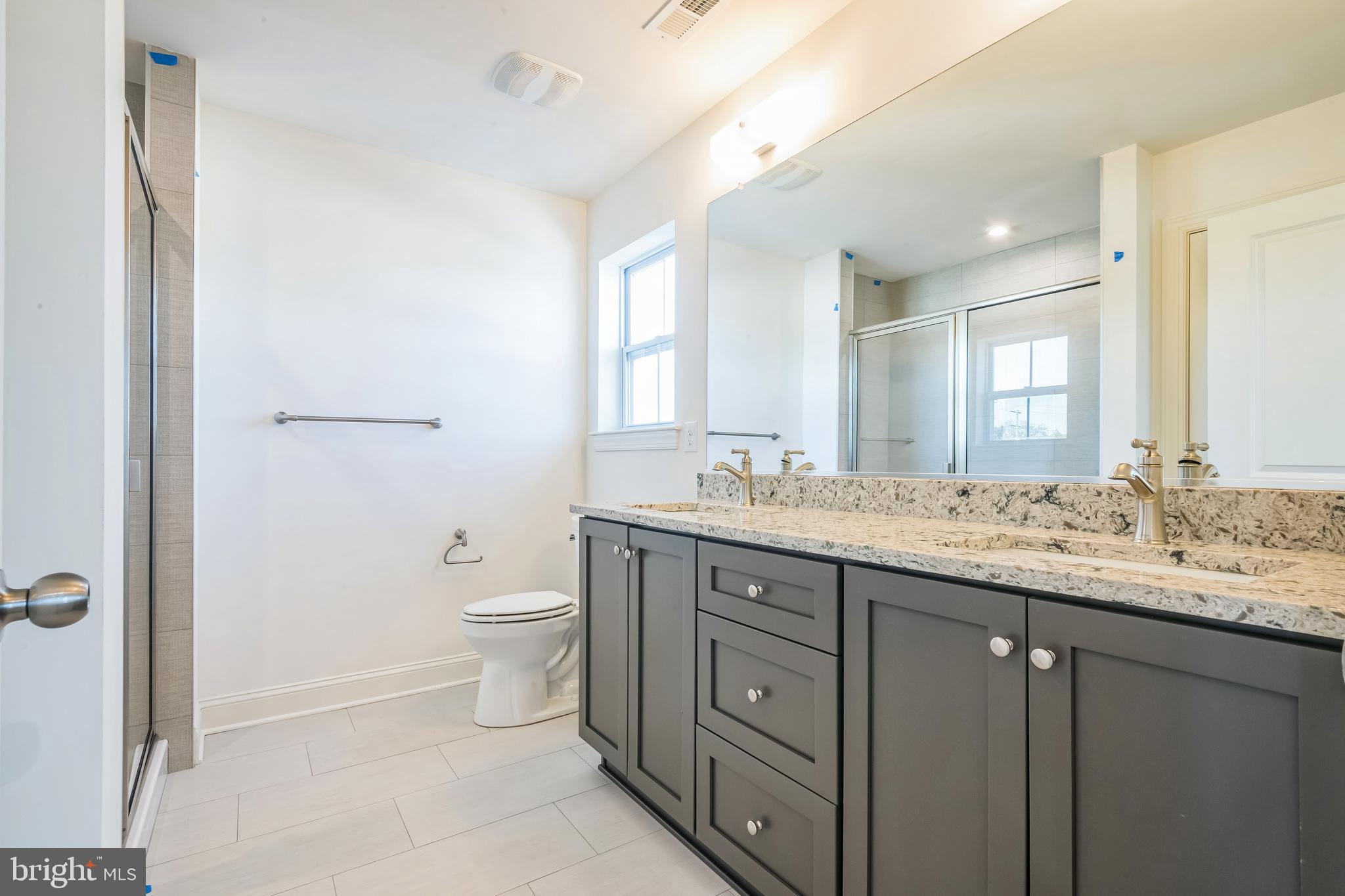 21 Plymouth Road Sicklerville, NJ 08081 - Photo 21 of 23 a bathroom with a granite countertop sink a toilet and a mirror