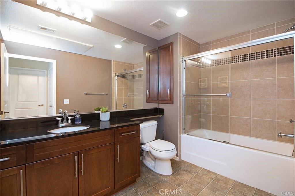 2420 Scholarship Irvine, CA 92612 - Photo 11 of 17 a bathroom with a double vanity sink toilet and shower
