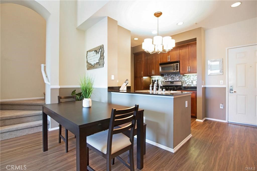 2420 Scholarship Irvine, CA 92612 - Photo 3 of 17 a kitchen with a table and chairs in it
