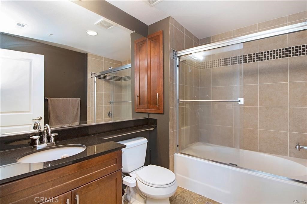 2420 Scholarship Irvine, CA 92612 - Photo 8 of 17 a bathroom with a bathtub shower sink mirror vanity and toilet